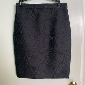 8 Crepe black skirt with raised floral detailing.